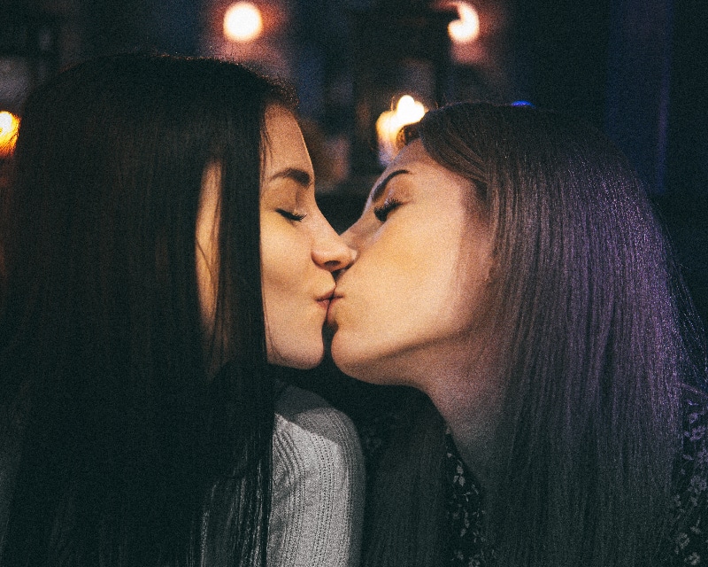 two girls kissing each other